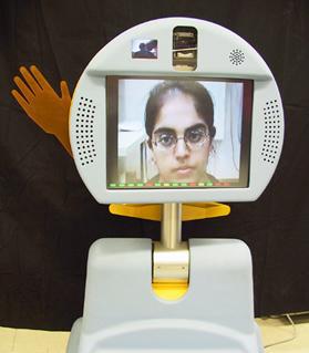 The Pebbles robot has a computer for a head on which is seen the face of a child
