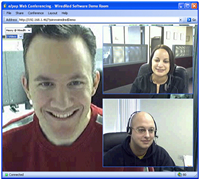 An image of an online video conference. The screen is split between three video images of the participants.